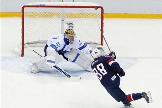USA forward Patrick Kane hits the post as he shoots on Finland goaltender Tuukka Rask during the second period of the men's bronze medal ice hockey game at the 2014 Winter Olympics, Saturday, Feb. 22, 2014, in Sochi, Russia. (AP Photo/David J. Phillip  )