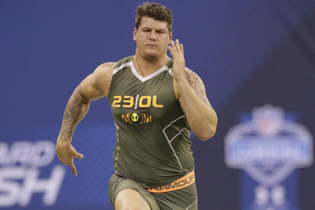 Michigan offensive lineman Taylor Lewan runs the 40-yard dash at the NFL football scouting combine in Indianapolis, Saturday, Feb. 22, 2014. (AP Photo/Nam Y. Huh)