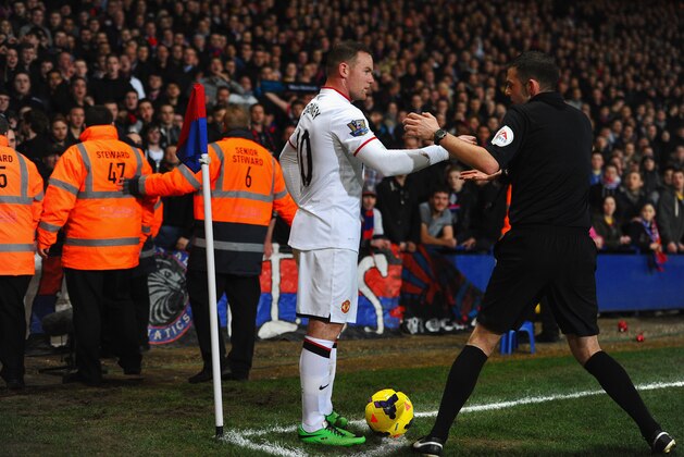 LONDON, ENGLAND - FEBRUARY 22:  Wayne Rooney of Manchester United has coins thrown at him by the fans during the Barclays Premier League match between Crystal Palace and Manchester United at Selhurst Park on February 22, 2014 in London, England.  (Photo by Laurence Griffiths/Getty Images)