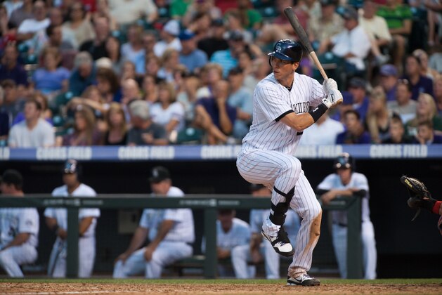 DENVER, CO - JULY 14: Tyler Colvin #21 of the Colorado Rockies bats during a game against the Philadelphia Phillies at Coors Field on July 14, 2012 in Denver, Colorado. The Phillies defeated the Rockies 8-5.  (Photo by Dustin Bradford/Getty Images)