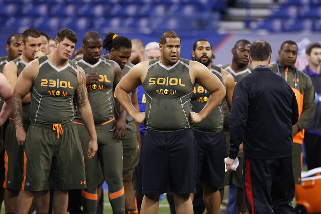 INDIANAPOLIS, IN - FEBRUARY 22: A group of offensive linemen listen to instruction during the 2014 NFL Combine at Lucas Oil Stadium on February 22, 2014 in Indianapolis, Indiana. (Photo by Joe Robbins/Getty Images)