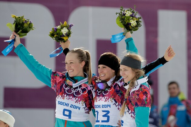 SOCHI, RUSSIA - FEBRUARY 22:  Gold medalist Julia Dujmovits (C) of Austria celebrates with silver medalist Anke Karstens (L) of Germany and bronze medalist Amelie Kober (R) of Germany in the Snowboard Ladies' Parallel Slalom Big Final on day 15 of the 2014 Winter Olympics at Rosa Khutor Extreme Park on February 22, 2014 in Sochi, Russia.  (Photo by Adam Pretty/Getty Images)