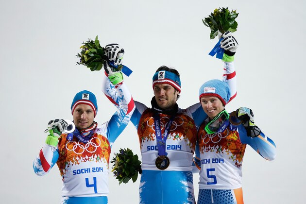 SOCHI, RUSSIA - FEBRUARY 22:  l-r: Silver medalist Marcel Hirscher of Austria, Gold medalist Mario Matt of Austria and bronze medalist Henrik Kristoffersen of Norway celebrate on the podium during the medal ceremony for the Men's Slalom during day 15 of the Sochi 2014 Winter Olympics at Rosa Khutor Alpine Center on February 22, 2014 in Sochi, Russia.  (Photo by Ezra Shaw/Getty Images)