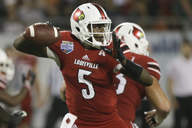 Louisville quarterback Teddy Bridgewater throws a pass during the first half of the Russell Athletic Bowl NCAA college football game against Miami in Orlando, Fla., Saturday, Dec. 28, 2013.(AP Photo/John Raoux)