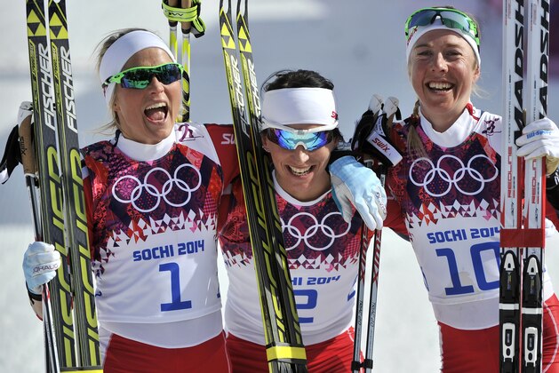 SOCHI, RUSSIA - FEBRUARY 22: (FRANCE OUT) Marit Bjoergen of Norway wins gold medal, Therese Johaug of Norway wins silver medal, Kristin Stoermer Steira of Norway wins bronze medal during the Cross-Country Women's 30km Mass Start at the Laura Cross-country Ski & Biathlon Center on February 22, 2014 in Sochi, Russia. (Photo by Vianney Thibaut/Agence Zoom/Getty Images)
