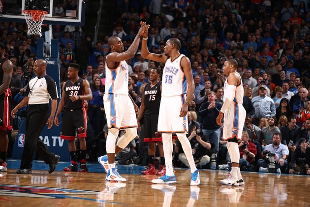 OKLAHOMA CITY, OK - FEBRUARY 20: Kevin Durant #35 of the Oklahoma City Thunder and Serge Ibaka #9 of the Oklahoma City Thunder celebrate during a game against the Miami Heat at Chesapeake Energy Arena on February 20, 2014 in Oklahoma City, Oklahoma. NOTE TO USER: User expressly acknowledges and agrees that, by downloading and/or using this photograph, user is consenting to the terms and conditions of the Getty Images License Agreement.  Mandatory Copyright Notice: Copyright 2014 NBAE (Photo by Nathaniel S. Butler/NBAE via Getty Images)