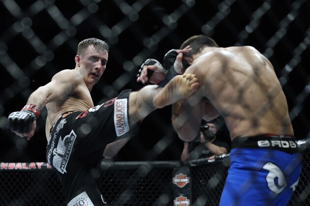 Rory MacDonald, left, kicks Demian Maia during a UFC 170 mixed martial arts welterweight fight on Saturday, Feb. 22, 2014, in Las Vegas. MacDonald won by unanimous decision. (AP Photo/Isaac Brekken)