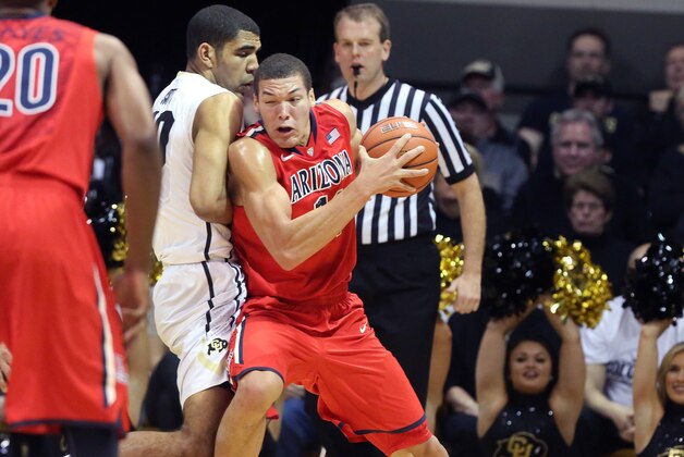 Arizona's Aaron Gordon tries to get around Colorado's Josh Scott during the first half of an NCAA college basketball game, in Boulder, Colo., Saturday, Feb. 22, 2014. (AP Photo/Brennan Linsley)