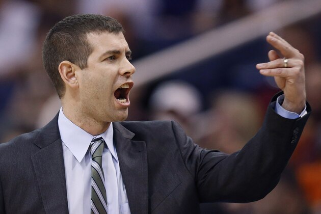 Boston Celtics head coach Brad Stevens shouts to one of his players during the second half of an NBA basketball game against the Phoenix Suns, Wednesday, Feb. 19, 2014, in Phoenix.  The Suns defeated the Celtics 100-94. (AP Photo/Ross D. Franklin)