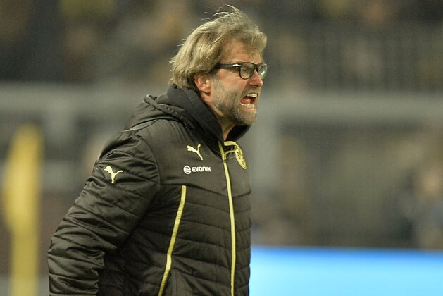 Dortmund head coach Juergen Klopp reacts angry during the German Bundesliga soccer match between Borussia Dortmund and FC Augsburg in Dortmund,  Germany, Saturday, Jan. 25, 2014. The match ended 2-2. (AP Photo/Martin Meissner)