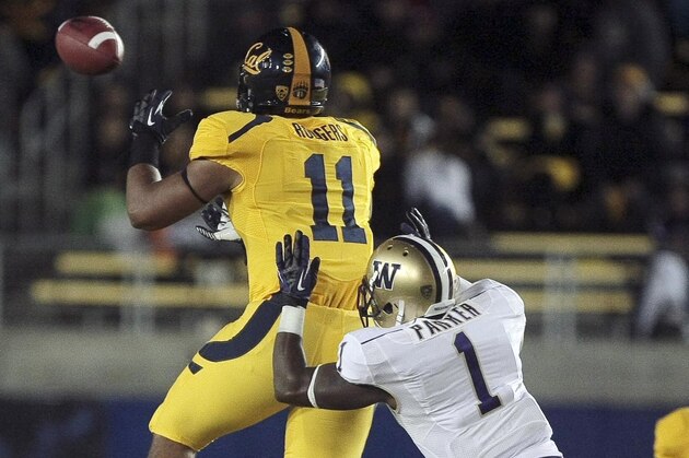 November 02, 2012; Berkeley, CA, USA; California Golden Bears tight end Richard Rodgers (11) catches a pass against Washington Huskies safety Sean Parker (1) during the fourth quarter at Memorial Stadium. Washington won 21-13. Mandatory Credit: Kelley L Cox-USA TODAY Sports