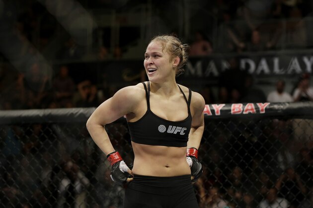 Ronda Rousey reacts after defeating Sara McMann following a UFC 170 mixed martial arts women's bantamweight title bout on Saturday, Feb. 22, 2014, in Las Vegas. (AP Photo/Isaac Brekken)