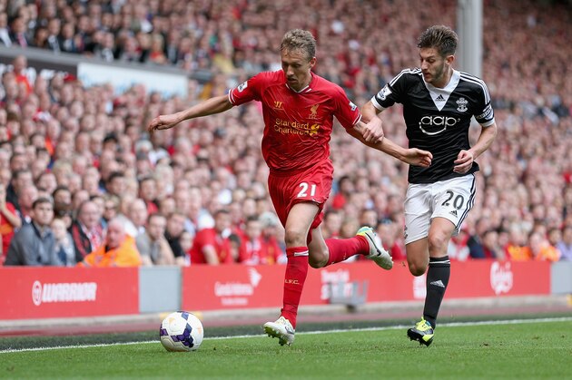 LIVERPOOL, ENGLAND - SEPTEMBER 21: Lucas of Liverpool in action with Adam Lallana of Southampton during the Barclays Premier League match between Liverpool and Southampton at Anfield on September 21, 2013 in Liverpool, England.  (Photo by Clive Brunskill/Getty Images)
