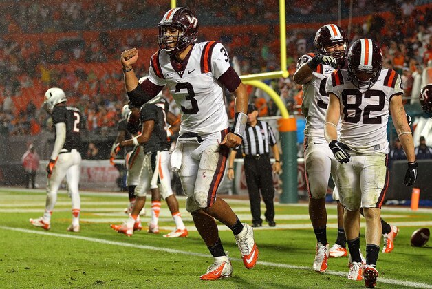 MIAMI GARDENS, FL - NOVEMBER 09:  Logan Thomas #3 of the Virginia Tech Hokies celebrates a touchdown during a game against the Miami Hurricanes at Sun Life Stadium on November 9, 2013 in Miami Gardens, Florida.  (Photo by Mike Ehrmann/Getty Images)