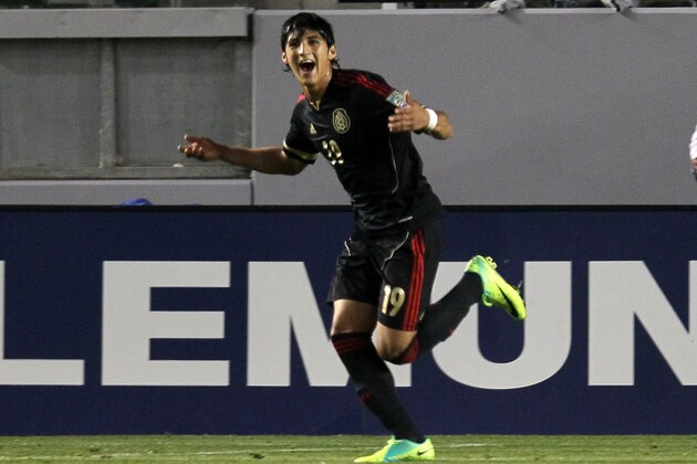CARSON, CA - MARCH 23:  Alan Pulido #19 of Mexico celebrates after scoring a goal in the first half against Trinidad and Tobago during the second day of 2012 CONCACAF Men's Olympic Qualifying at The Home Depot Center on March 23, 2012 in Carson, California.  (Photo by Stephen Dunn/Getty Images)