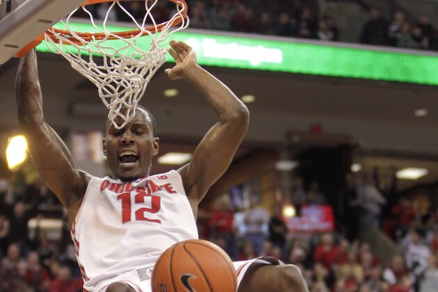 Ohio State's Sam Thompson, top, dunks the ball over Minnesota's Austin Hollins during the second half of an NCAA college basketball game Saturday, Feb. 22, 2014, in Columbus, Ohio. Ohio State defeated Minnesota 64-46. (AP Photo/Jay LaPrete)