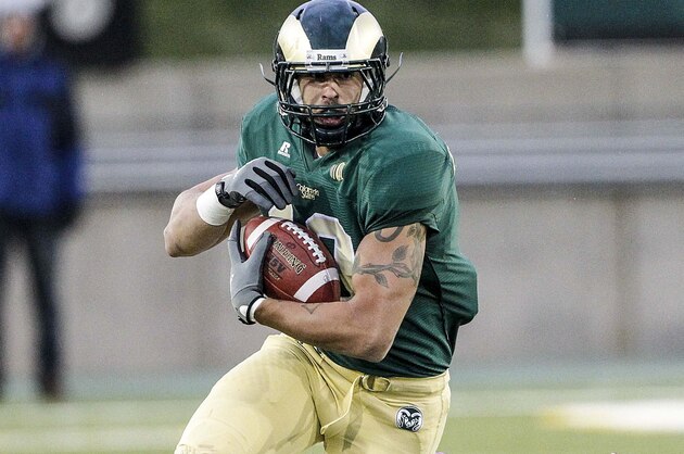 Oct 6, 2012; Fort Collins, WY, USA; Colorado State Rams tight end Crockett Gillmore (10) is tackled by Fresno State Bulldogs linebacker Patrick Su'a (30) during the first quarter.  The Bulldogs beat the Rams 28-7. Mandatory Credit: Troy Babbitt-USA TODAY Sports