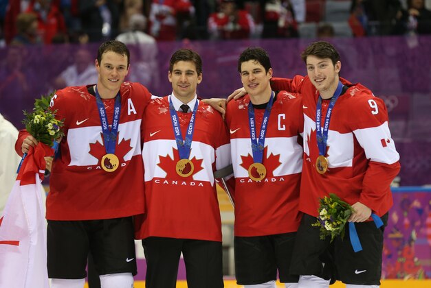 Feb 23, 2014; Sochi, RUSSIA; Canada forward Jonathan Toews (16), Canada forward Jon Tavares (20), Canada forward Sidney Crosby (87), and Canada forward Matt Duchene (9) celebrate winning the gold medal against Sweden in the men's ice hockey gold medal game during the Sochi 2014 Olympic Winter Games at Bolshoy Ice Dome. Mandatory Credit: Winslow Townson-USA TODAY Sports
