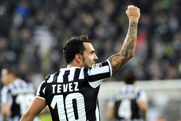Juventus forward Carlos Tevez, of Argentina, celebrates after scoring  during a Serie A soccer match between Juventus and Torino at the Juventus stadium, in Turin, Italy, Sunday, Feb. 23, 2014. (AP Photo/Massimo Pinca)
