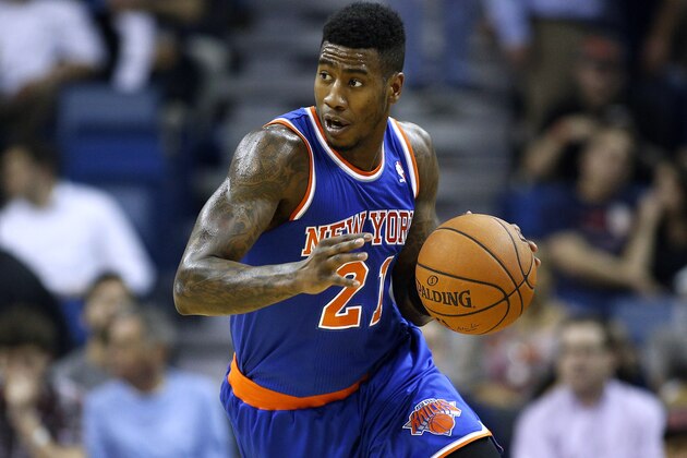 New York Knicks shooting guard Iman Shumpert (21) drives with the ball during the first quarter of an NBA basketball game in New Orleans, Wednesday, Feb. 19, 2014. (AP Photo/Jonathan Bachman)
