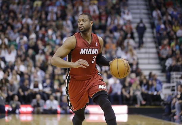 Miami Heat's Dwyane Wade (3) brings the ball up court in the second half of an NBA basketball game against the Utah Jazz Saturday, Feb. 8, 2014, in Salt Lake City. (AP Photo/Rick Bowmer)