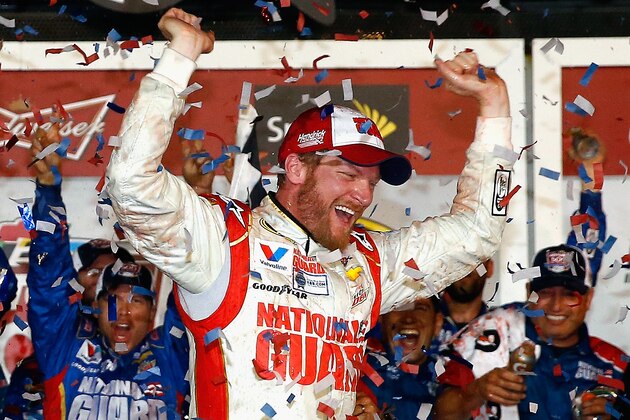 DAYTONA BEACH, FL - FEBRUARY 23:  Dale Earnhardt Jr., driver of the #88 National Guard Chevrolet, celebrates in Victory Lane after winning during the NASCAR Sprint Cup Series Daytona 500 at Daytona International Speedway on February 23, 2014 in Daytona Beach, Florida.  (Photo by Tom Pennington/Getty Images)