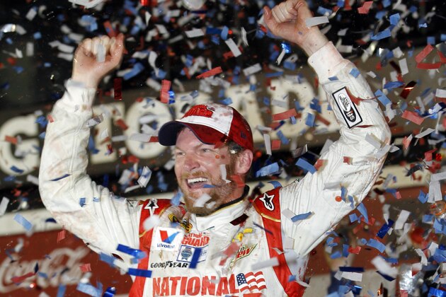 Dale Earnhardt Jr. celebrates in Victory Lane after winning the NASCAR Daytona 500 Sprint Cup series auto race at Daytona International Speedway in Daytona Beach, Fla., Sunday, Feb. 23, 2014. (AP Photo/Terry Renna)