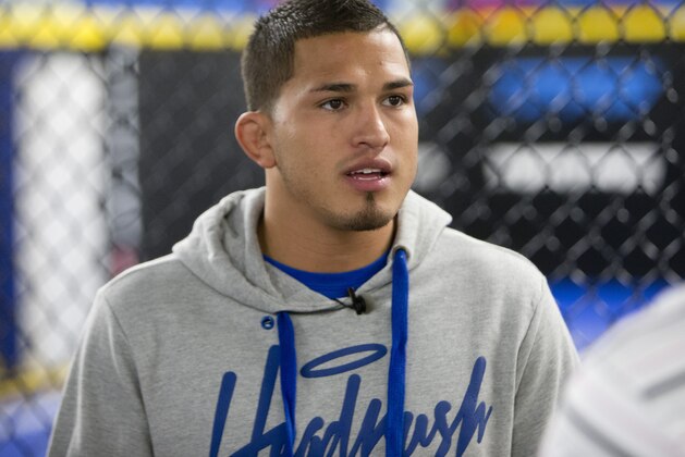 MILWAUKEE, WI - JANUARY 16:  Anthony Pettis takes an interview during Media Day at Roufusport Mixed Martial Arts Academy on January 16, 2014 in Milwaukee, Wisconsin. (Photo by Mike McGinnis/Getty Images)