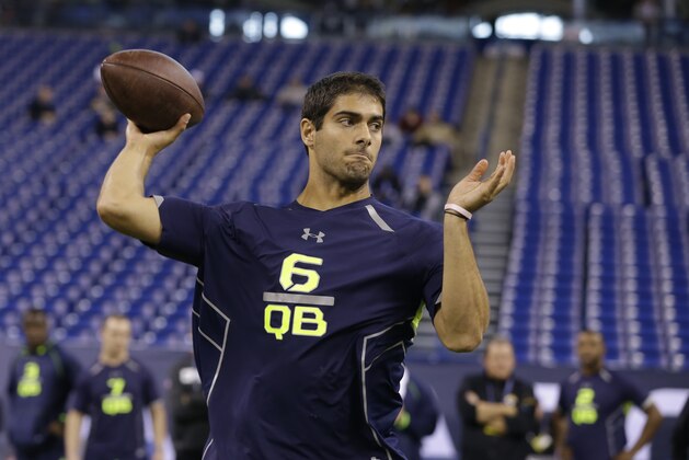 Eastern Illinois quarterback Jimmy Garoppolo throws during a drill at the NFL football scouting combine in Indianapolis, Sunday, Feb. 23, 2014. (AP Photo/Michael Conroy)