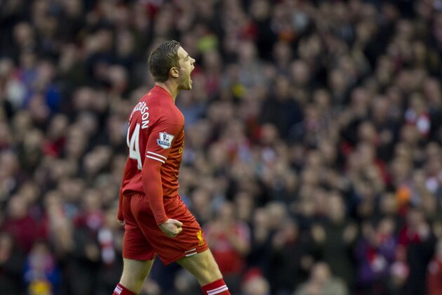 Liverpool's Jordan Henderson celebrates after scoring against Swansea City during their English Premier League soccer match at Anfield Stadium, Liverpool, England, Sunday Feb. 23, 2014. (AP Photo/Jon Super)