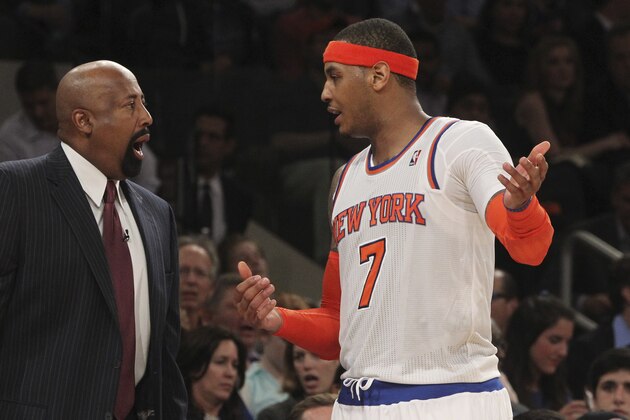 New York Knicks head coach Mike Woodson, left, speaks to Carmelo Anthony during the second half of Game 2 of their NBA basketball playoff series against the Indiana Pacers in the Eastern Conference semifinals  Tuesday, May 7, 2013, at Madison Square Garden in New York. The Knicks won 105-79. (AP Photo/Mary Altaffer)