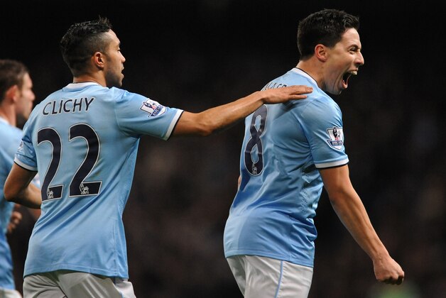 Manchester City's Samir Nasri, right, celebrates after scoring against Chelsea, with teammate Gael Clichy, left, during the English FA Cup fifth round soccer match between Manchester City and Chelsea at The Etihad Stadium, Manchester, England, Saturday, Feb. 15, 2014. (AP Photo/Rui Vieira) Manchester City's Samir Nasri, right, celebrates after scoring against Chelsea, with teammate Gael Clichy, left, during the English FA Cup fifth round soccer match between Manchester City and Chelsea at The Etihad Stadium, Manchester, England, Saturday, Feb. 15, 2014. (AP Photo/Rui Vieira)