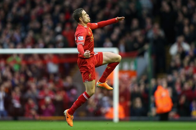 LIVERPOOL, ENGLAND - FEBRUARY 23:  Jordan Henderson of Liverpool celebrates scoring the second goal during the Barclays Premier League match between Liverpool and Swansea City at Anfield on February 23, 2014 in Liverpool, England.  (Photo by Clive Brunskill/Getty Images)