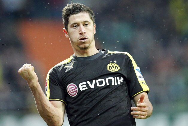 Dortmund's Robert Lewandowski of Poland celebrates after scoring during the German first division Bundesliga soccer match between Werder Bremen and Borussia Dortmund in Bremen, Germany, Saturday, Feb. 8, 2014. (AP Photo/Frank Augstein)