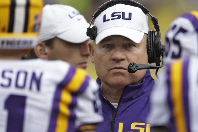 LSU head coach Les Miles talks to his team during the second quarter of the Outback Bowl NCAA college football game against Iowa Wednesday, Jan. 1, 2014, in Tampa, Fla. (AP Photo/Chris O'Meara)