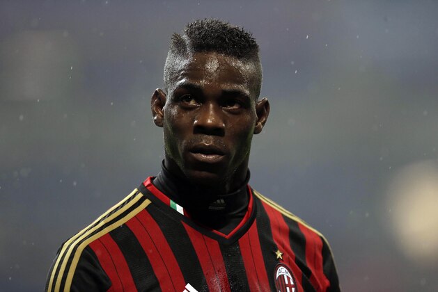AC Milan forward Mario Balotelli stands on the pitch during a Serie A soccer match between AC Milan and Hellas Verona, at the San Siro stadium in Milan, Italy, Sunday, Jan. 19, 2014. (AP Photo/Luca Bruno) AC Milan forward Mario Balotelli stands on the pitch during a Serie A soccer match between AC Milan and Hellas Verona, at the San Siro stadium in Milan, Italy, Sunday, Jan. 19, 2014. (AP Photo/Luca Bruno)
