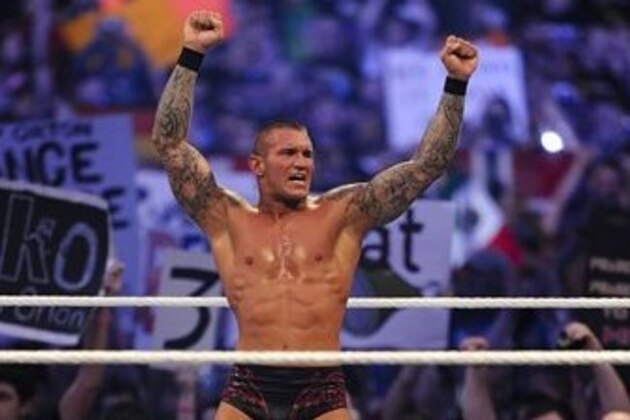 WWE Superstar Randy Orton celebrates defeating CM Punk (not pictured) during WrestleMania XXVII at the Georgia Dome in Atlanta, Georgia on Sunday, April 3, 2011. (Paul Abell/AP Images for WWE)