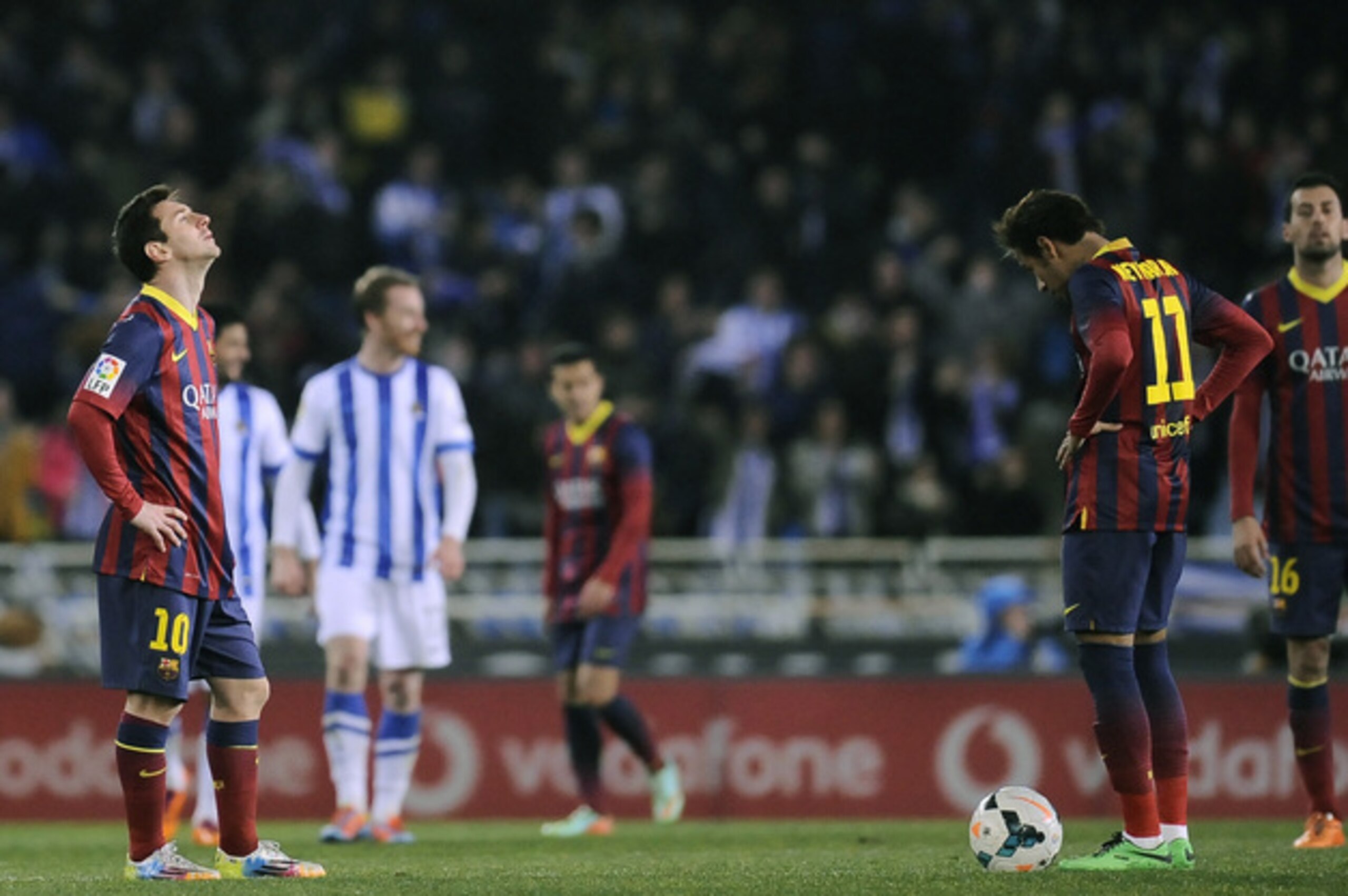 FC Barcelona's Lionel Messi of Argentina, left, and Neymar da Silva of Brazil, right, reflect after Real Sociedad scored during their Spanish League soccer match, at Anoeta  stadium in San Sebastian, Spain, Saturday, Feb. 22, 2014. (AP Photo/Alvaro Barrientos)
