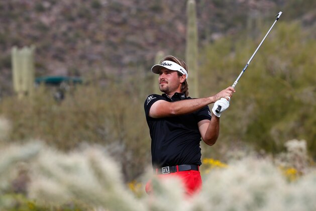 MARANA, AZ - FEBRUARY 23:  Victor Dubuisson of France plays a shot during the final round of the World Golf Championships - Accenture Match Play Championship at The Golf Club at Dove Mountain on February 23, 2014 in Marana, Arizona.  (Photo by Sam Greenwood/Getty Images)