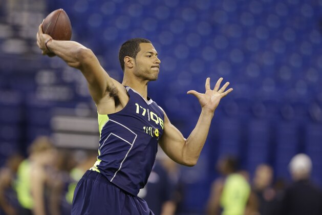 Virginia Tech quarterback Logan Thomas throws during a drill at the NFL football scouting combine in Indianapolis, Sunday, Feb. 23, 2014. (AP Photo/Michael Conroy)