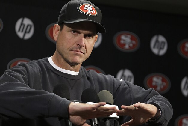 San Francisco 49ers coach Jim Harbaugh gestures during an NFL football news conference Tuesday, Jan. 21, 2014, in Santa Clara, Calif. (AP Photo/Ben Margot)