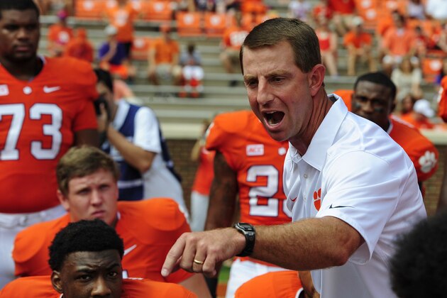 Clemson coach Dabo Swinney talks to his players before the start of an NCAA college football game Saturday against South Carolina State, Sept. 7, 2013 at Memorial Stadium in Clemson, S.C.(AP Photo/ Richard Shiro)