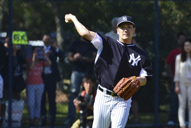 Feb 19, 2014; Tampa, FL, USA; New York Yankees pitcher Masahiro Tanaka (19) throws during spring morning practice at George M. Steinbrenner Field. Mandatory Credit: Tommy Gilligan-USA TODAY Sports