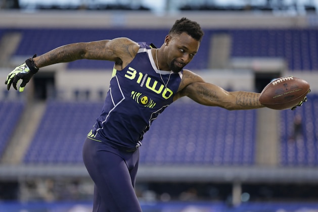Louisiana State wide receiver Jarvis Landry makes a one-handed catch during a drill at the NFL football scouting combine in Indianapolis, Sunday, Feb. 23, 2014. (AP Photo/Michael Conroy)