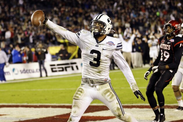 FILE - In this Dec. 20, 2012, file photo, BYU linebacker Kyle Van Noy holds out the ball as he scores on a 17-yard interception return during the fourth quarter of the Poinsettia Bowl NCAA college football game against San Diego State, in San Diego. This weekend, Texas faces a stingy BYU defense that was one of the country's best last season.  (AP Photo/Lenny Ignelzi, File)