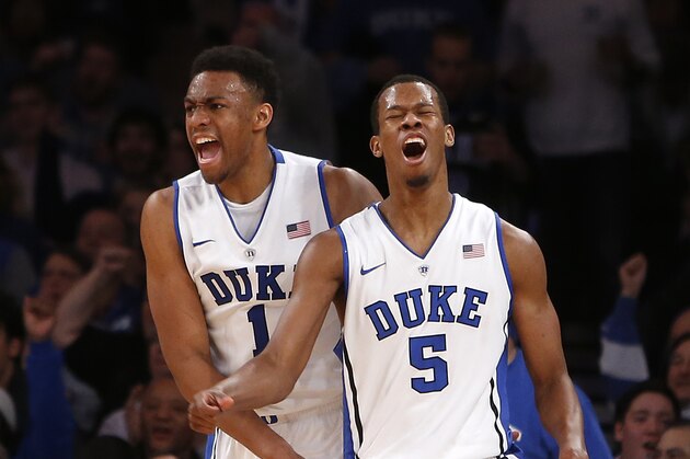 Duke's Jabari Parker (1) and Rodney Hood (5) celebrate during the second half of an NCAA college basketball game against UCLA, Thursday, Dec. 19, 2013, in New York. Duke won 80-63. (AP Photo/Jason DeCrow)