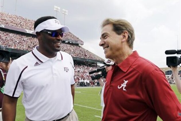 Alabama head coach Nick Saban, right, and Texas A&M head coach Kevin Sumlin greet before an NCAA college football game Saturday, Sept. 14, 2013, in College Station, Texas. (AP Photo/David J. Phillip)
