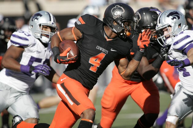STILLWATER, OK - OCTOBER 5:   Cornerback Justin Gilbert #4 of the Oklahoma State Cowboys returns a kickoff against the Kansas State Wildcats October 5, 2013 at Boone Pickens Stadium in Stillwater, Oklahoma. The Cowboys defeated the Wildcats 33-29.  (Photo by Brett Deering/Getty Images)
