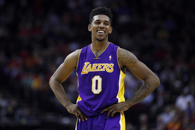 Jan 8, 2014; Houston, TX, USA; Los Angeles Lakers small forward Nick Young (0) reacts to a fan during the third quarter against the Houston Rockets at Toyota Center. Mandatory Credit: Andrew Richardson-USA TODAY Sports Jan 8, 2014; Houston, TX, USA; Los Angeles Lakers small forward Nick Young (0) reacts to a fan during the third quarter against the Houston Rockets at Toyota Center. Mandatory Credit: Andrew Richardson-USA TODAY Sports