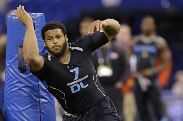 Pittsburgh defensive lineman Aaron Donald runs a drill at the NFL football scouting combine in Indianapolis, Monday, Feb. 24, 2014. (AP Photo/Michael Conroy)
